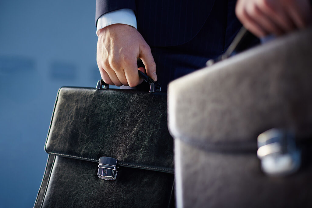 Close up of lawyer's holding briefcases