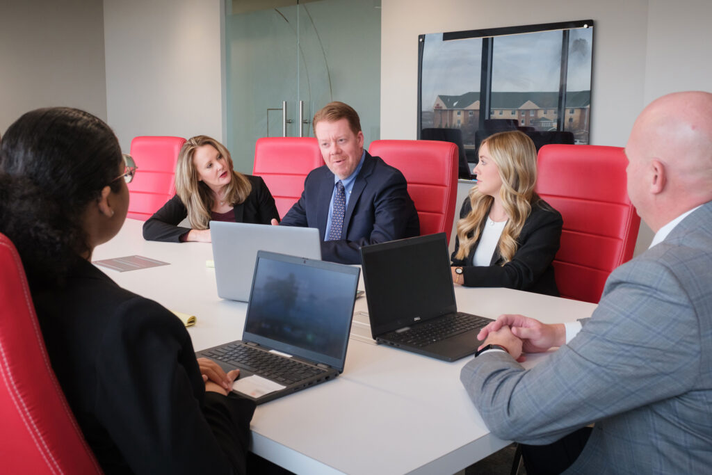 Lawyers discussing investment property law in conference room