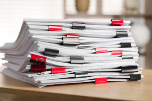 Stack of legal documents with binder clips