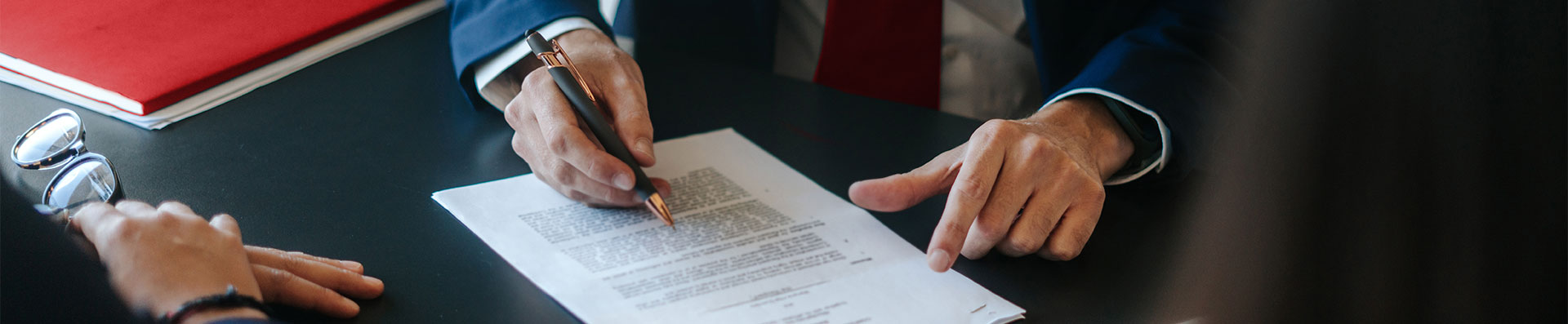 Lawyer signing legal document
