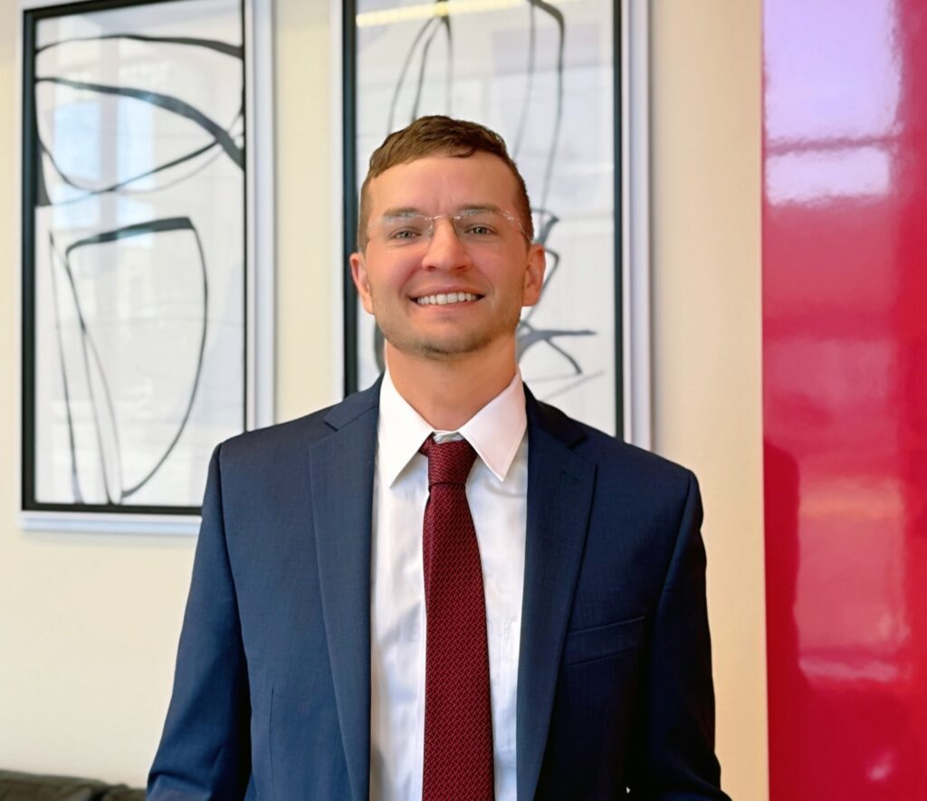 Chris Chochon standing in Goosmann office in Omaha