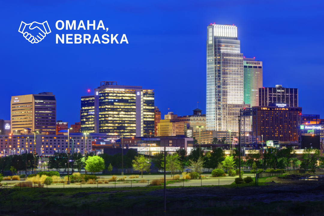 Omaha Nebraska skyline at night and Midwest business market