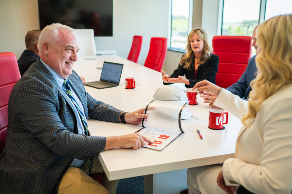 Goosmann team discussing employee benefit services
