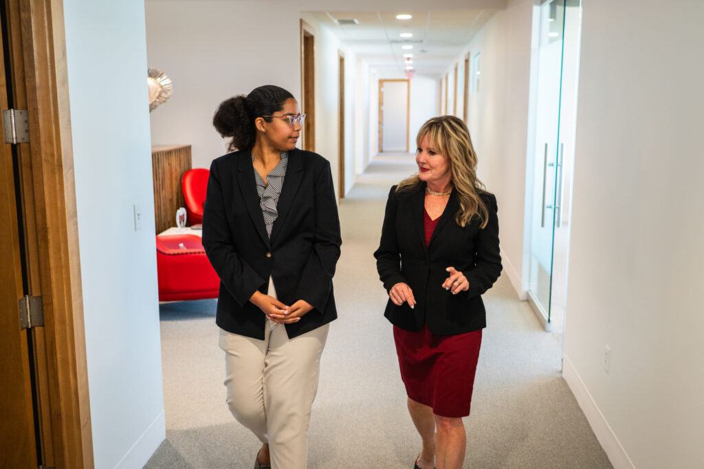 Goosmann team walking in hallway